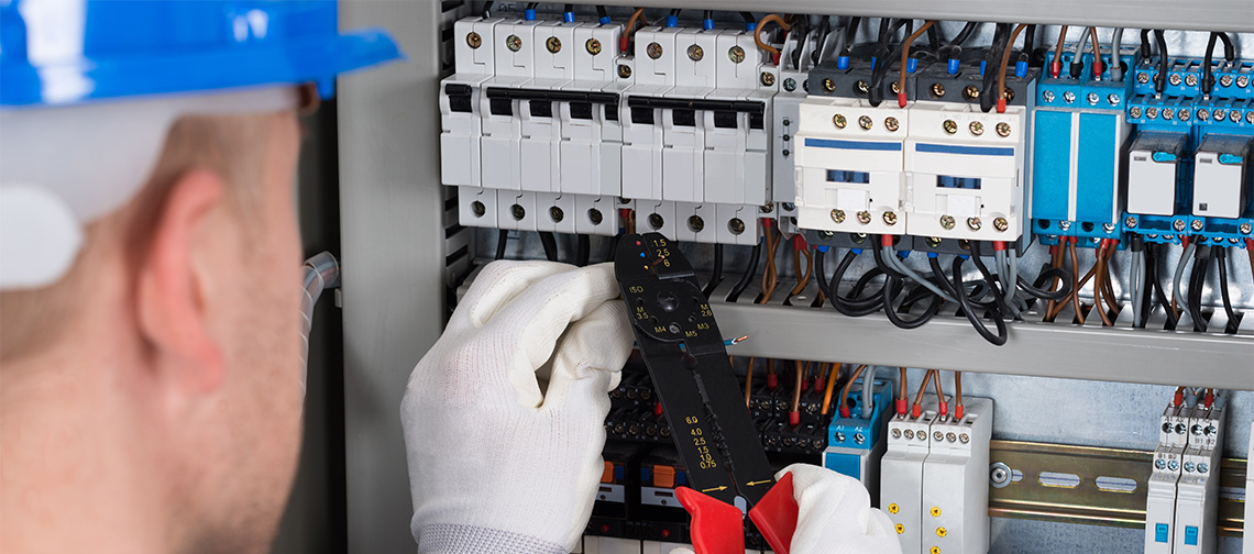 Electrican working on a eletrical pannel box